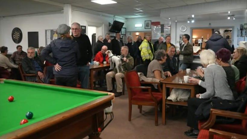 A group of people in a social club