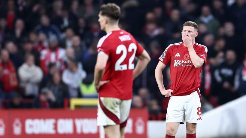 Nottingham Forest players stand dejected after the full time whistle