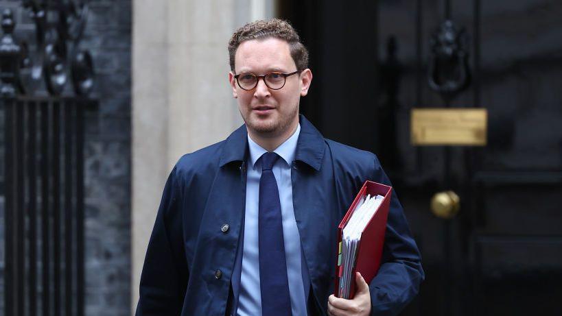 Chief Secretary to the Treasury Darren Jones walking out of Downing Street carrying a red folder