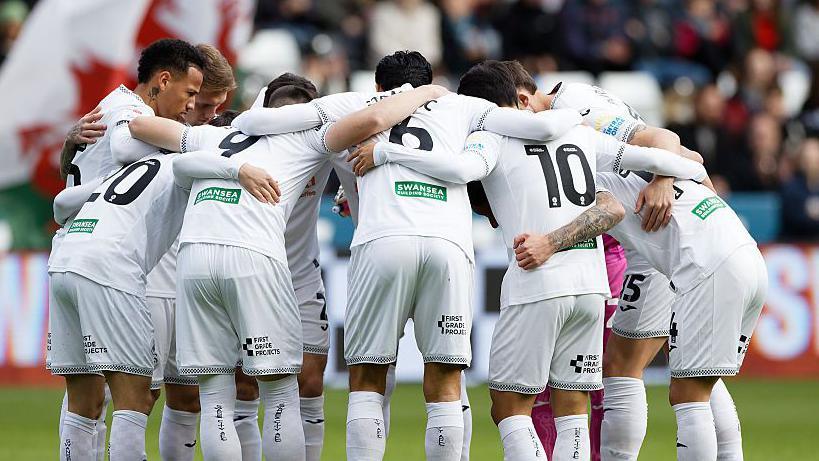 Swansea players in a huddle