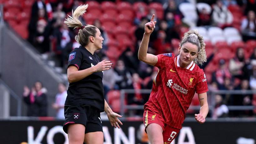 Leanne Kiernan celebrates scoring Liverpool's goal. 