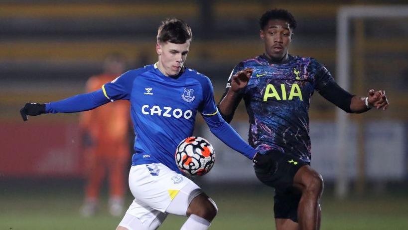 Rhys Hughes of Everton is challenged by Malachi Fagan-Walcott of Spurs