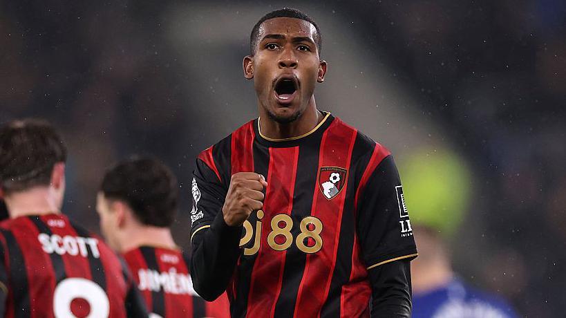 Rayan punches the air while celebrating a goal for Bournemouth