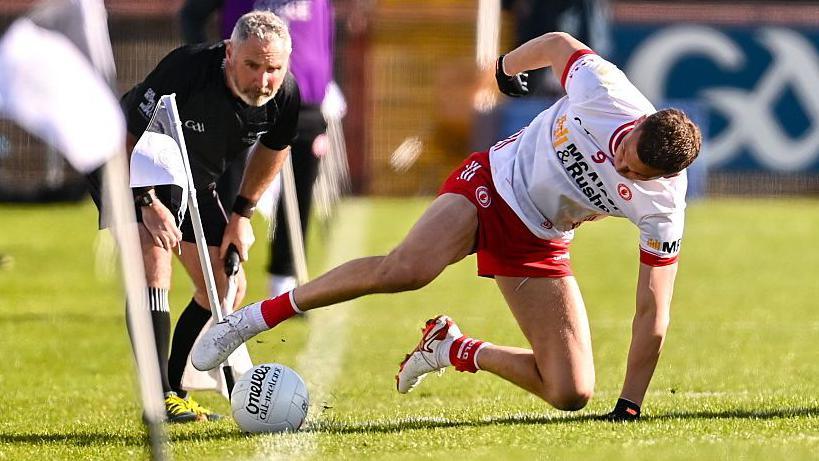 Tyrone midfielder Conn Kilpatrick tries to keep the play alive during Tyrone's clash with Cavan in Healy Park