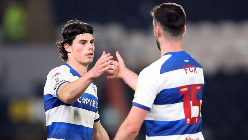 QPR's Ronnie Edwards and Morgan Foix shake hands