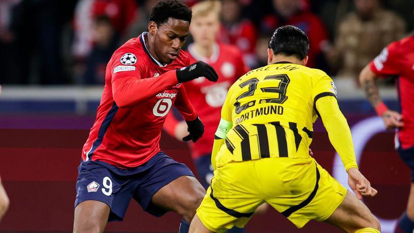 Jonathan David playing for Lille against Borussia Dortmund