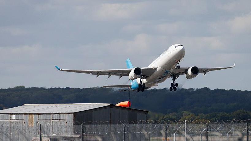 A plane taking flight from Gatwick Airport