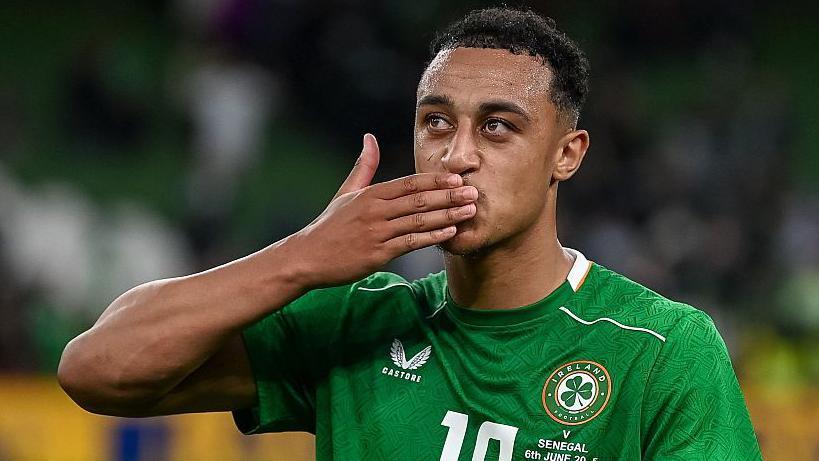 Adam Idah celebrates in a Republic of Ireland shirt in June