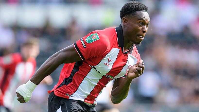 Tanto Olaofe in action for Lincoln in the EFL Cup against Derby