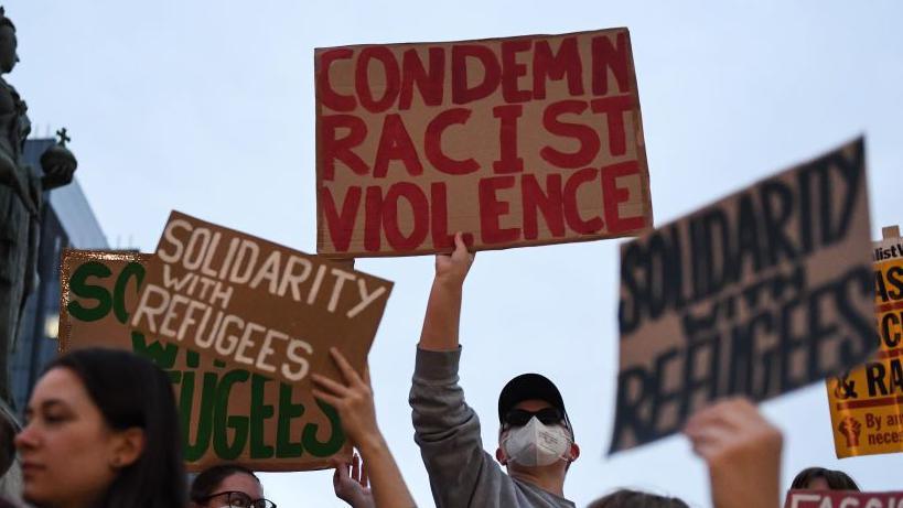 People holding up signs. 