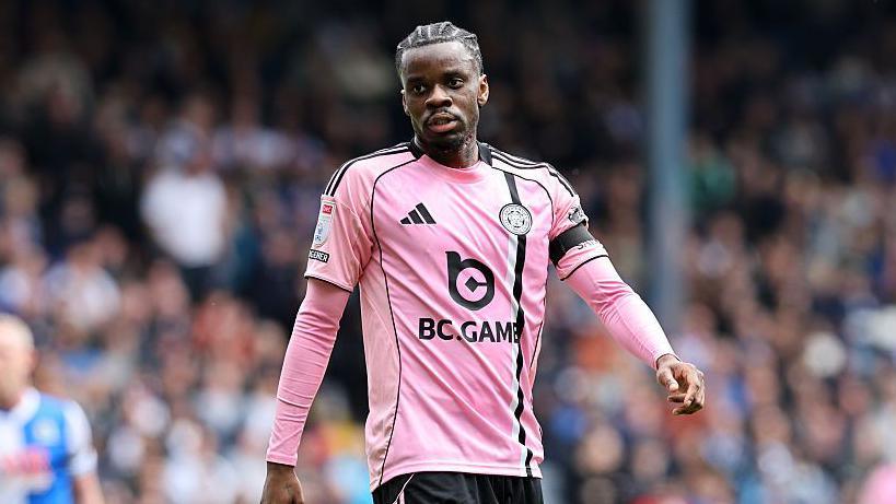 Leicester City player Stephy Mavididi , in pink shirt, walks during the game at Blackburn.