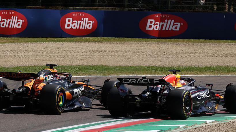 Oscar Piastri and Max Verstappen at the first corner of the Emilia-Romagna Grand Prix.
