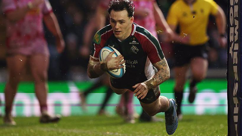 Will Wand dives over the line to score a try for Leicester Tigers