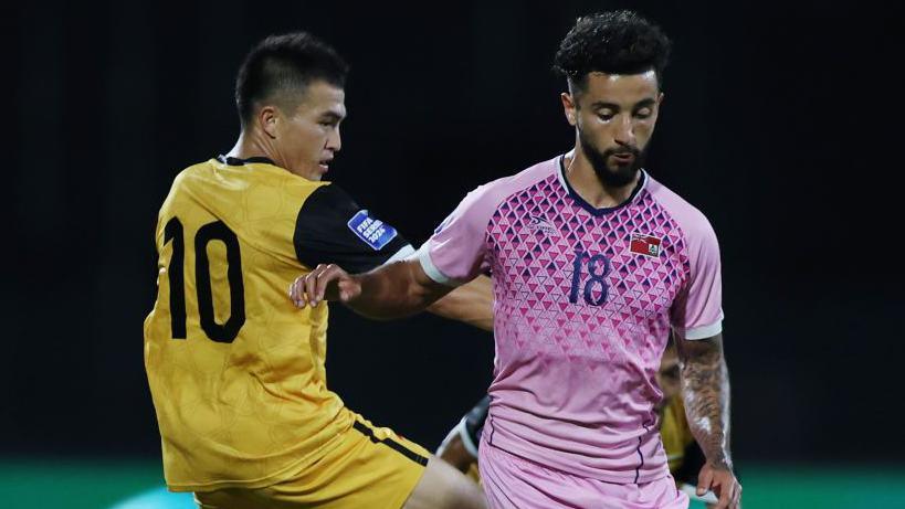 Luke Robinson, right, playing for Bermuda