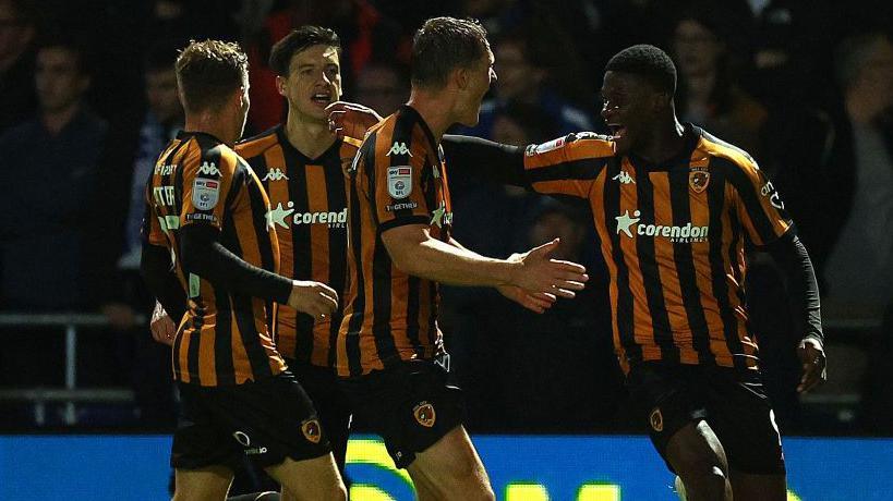 Chris Bedia celebrates with his Hull City teammates