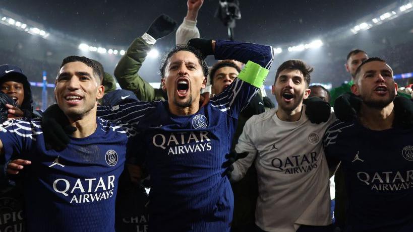 Paris St-Germain's players celebrate after beating Manchester City