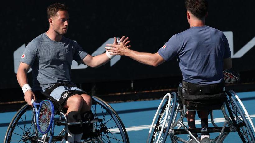 Alfie Hewett celebrates winning a point with doubles partner Gordon Reid