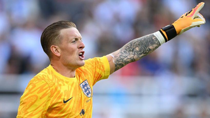 Jordan Pickford shouts during an England game