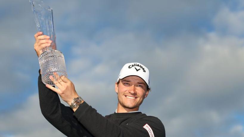 Hojgaard hoists the Irish Open trophy aloft 