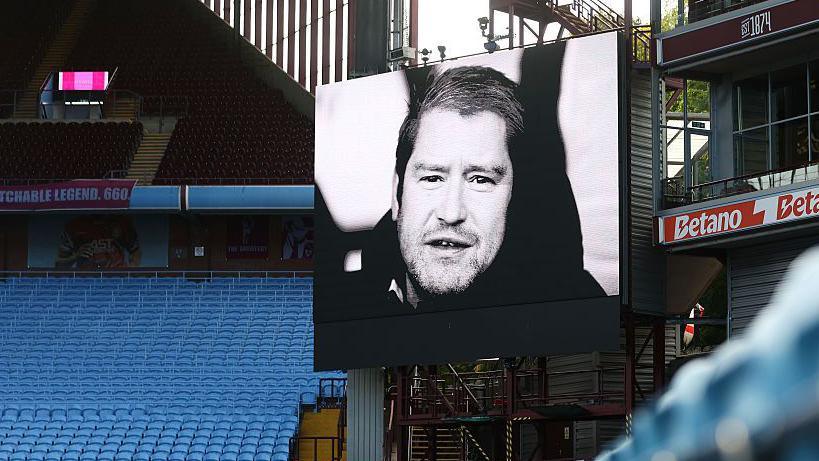 A black and white image of Matt Beard at Villa Park