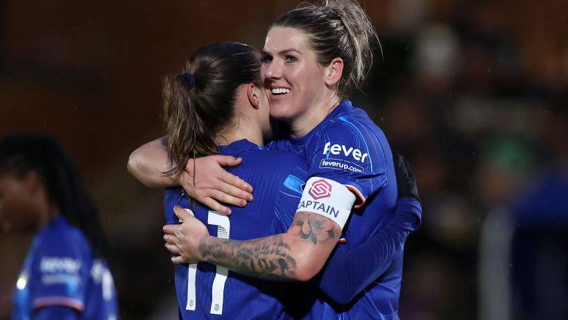 Millie Bright embraces a Chelsea team-mate