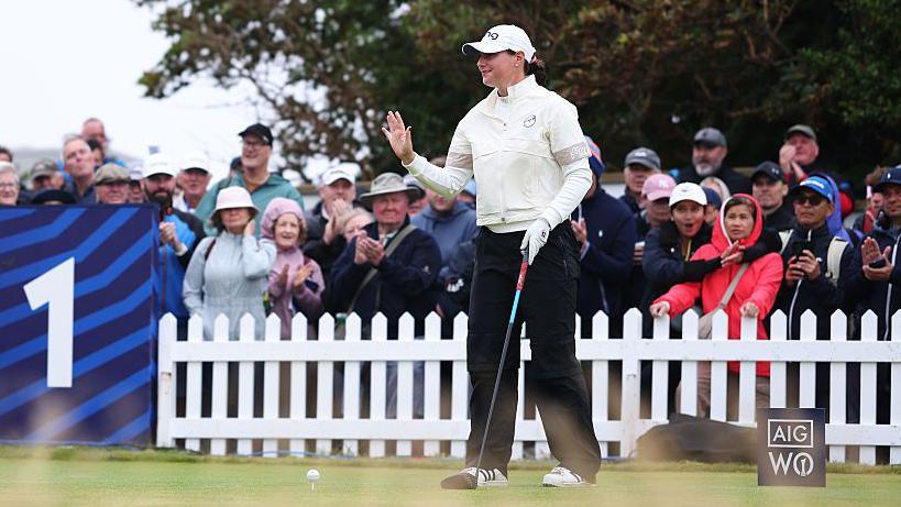Darcey Harry acknowledges the crowd on the first tee during the final round of the AIG Women's Open 2025