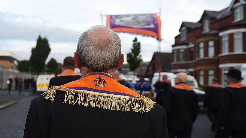 Back view of Orangemen marching