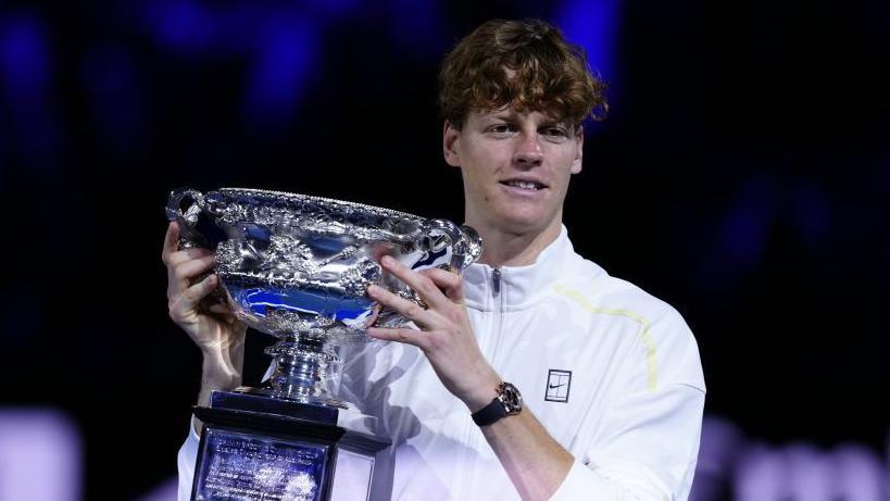 Jannik Sinner with the Australian Open men's singles trophy