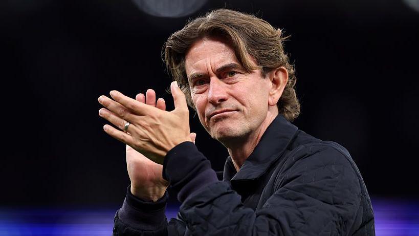 Tottenham boss Thomas Frank applauds the fans after his side's win against Villarreal