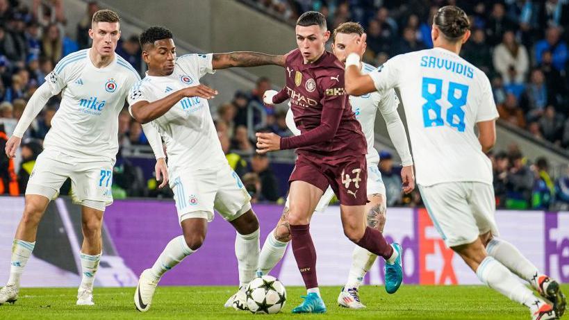 Manchester City's Phil Foden tries to dribble through the Slovan Bratislava midfield