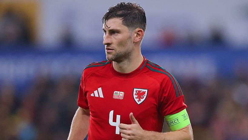 Ben Davies in action for Wales