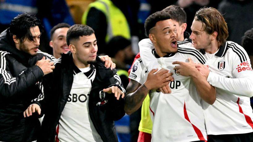 Fulham's players celebrate their first win at Chelsea in 45 years