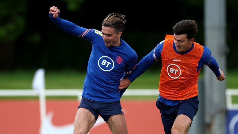 Jack Grealish and Harry Maguire in action during England training