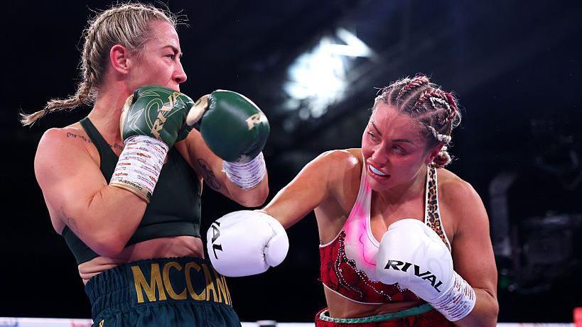 Ebonie Cotton throws a punch at Molly McCann