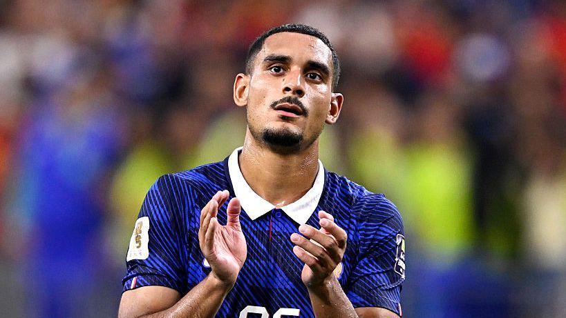 France defender Maxence Lacroix applauds supporters after the World Cup semi-final against Spain
