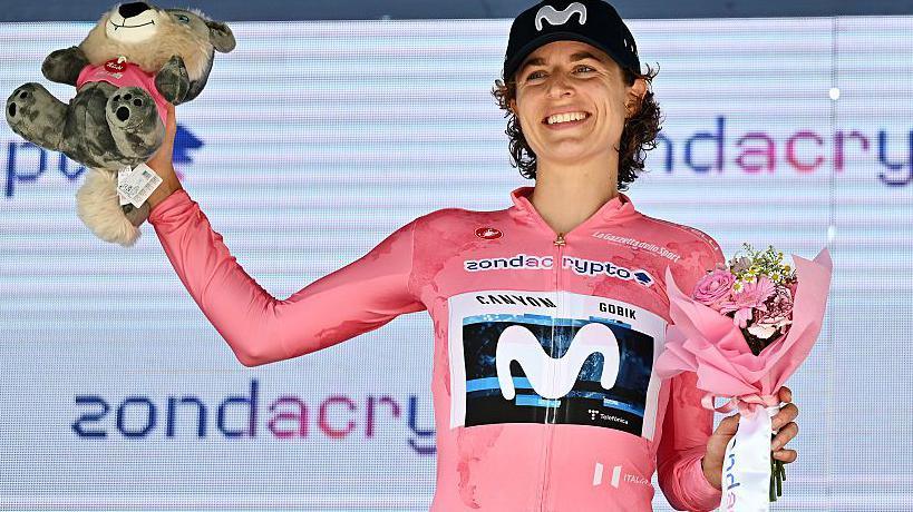 Marlen Reusser celebrating connected nan podium