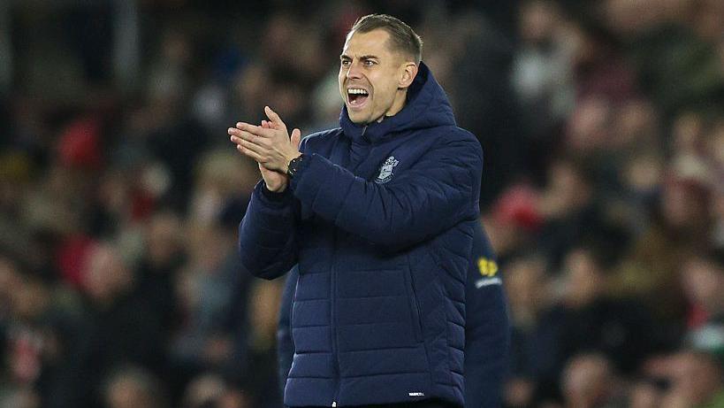 Tonda Eckert applauds his players from the touchline