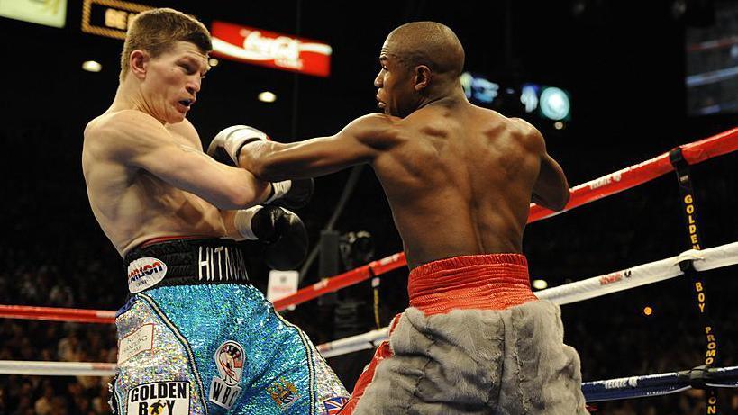 Ricky Hatton tries to avoid a punch from Floyd Mayweather