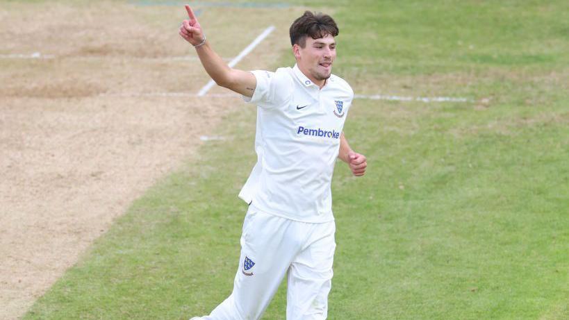 Henry Crocombe celebrates taking a wicket for Sussex