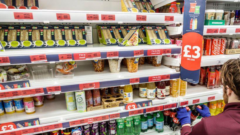 A supermarket shelf showing sandwiches and drinks included in a meal deal