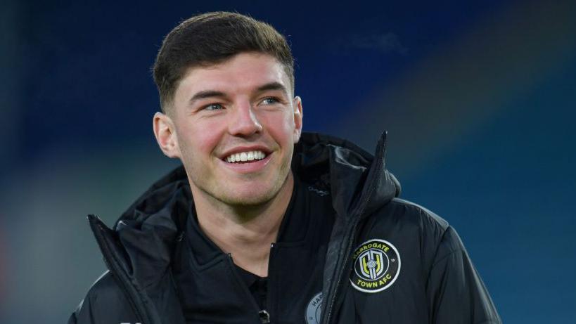 Ellis Taylor smiles at Harrogate's FA Cup third round match against Leeds 