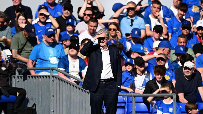 Roy Hodgson on the sideline with his hand over his eyes to help him see the pitch at St. Andrew's during Bristol City's 2-1 loss to Birmingham City