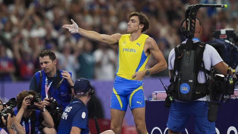 Armand Duplantis celebrates winning pole vault gold at the 2024 Paris Olympics