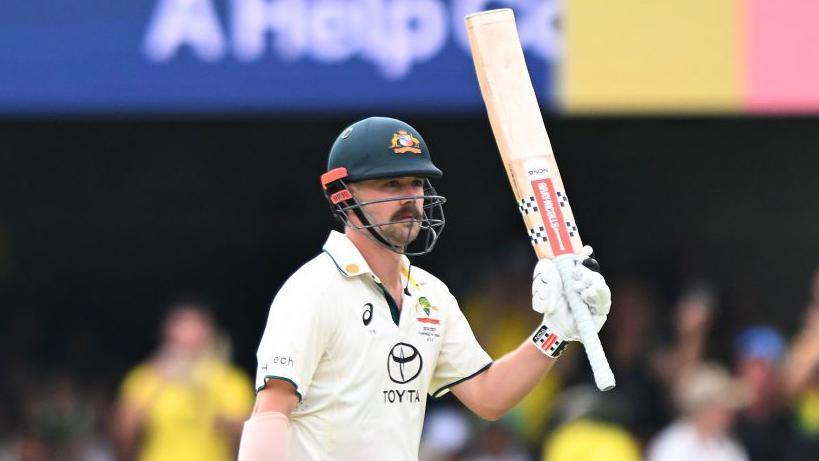 Travis Head raising his bat