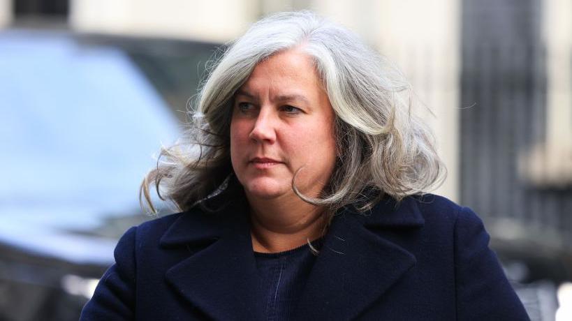 Transport Secretary Heidi Alexander walks outside Downing Street in a navy blue coat