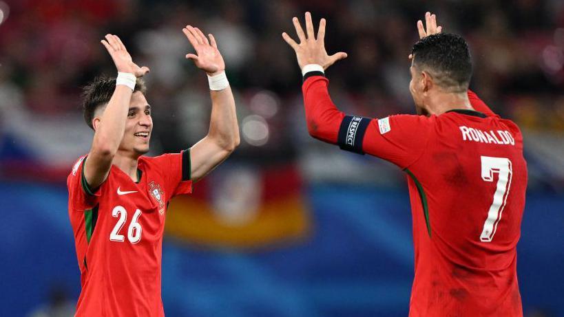 Cristiano Ronaldo celebrates with Francisco Conceicao after the youngster's winner against Czech Republic