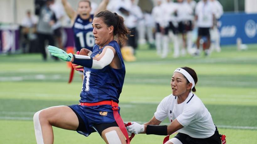 Marta Mathews playing for Great Britain against Japan at the 2025 World Games