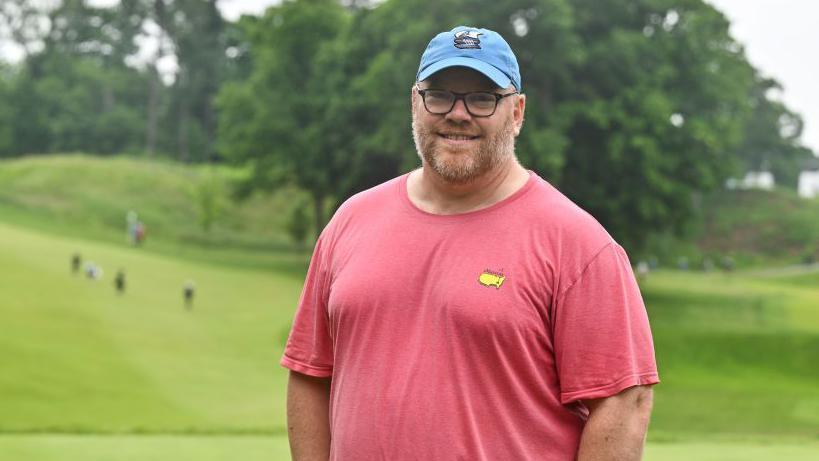 Paul Emerson smiling having caddied for PGA Golfer