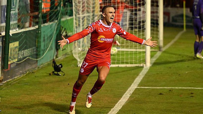 Evan Caffrey celebrates scoring