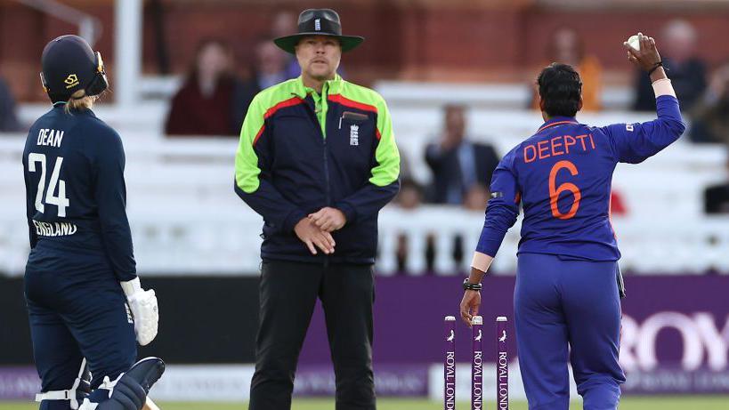 Charlie Dean reacts after being run out at the non-striker's end by Deepti Sharma of India